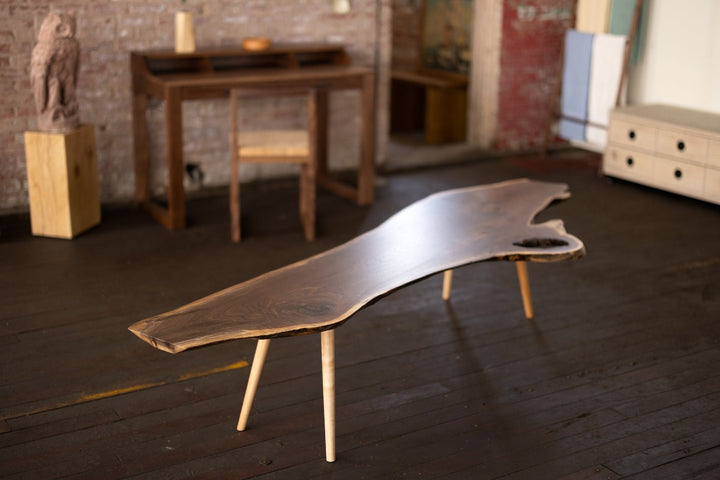 Live Edge Walnut Wood Slab Coffee Table with Turned Legs in room with desk