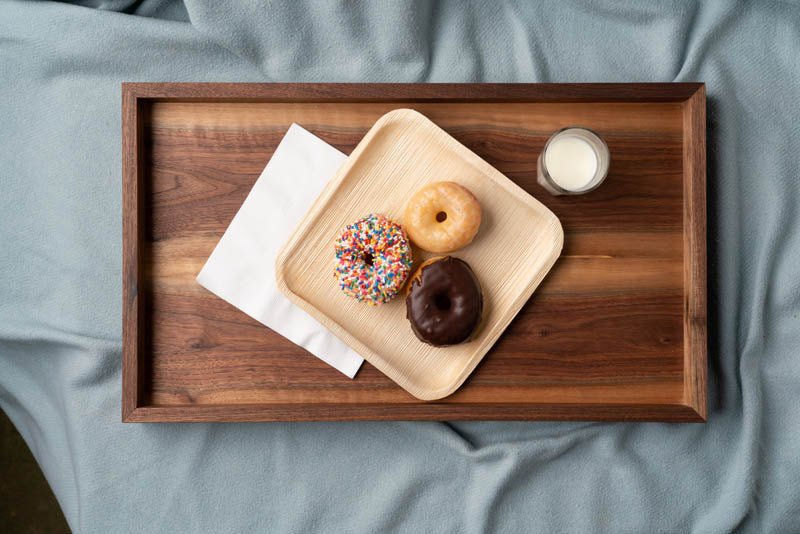 Modern Wooden Tray viewed from above serving donuts and milk
