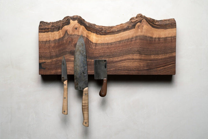 Magnetic Wooden Knife Holder holding kitchen knives