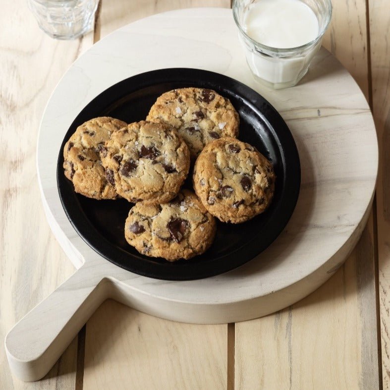 Maple Cutting Board with handle serving freshly baked cookies.