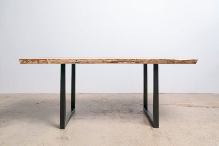 wood dining table with sunrise base