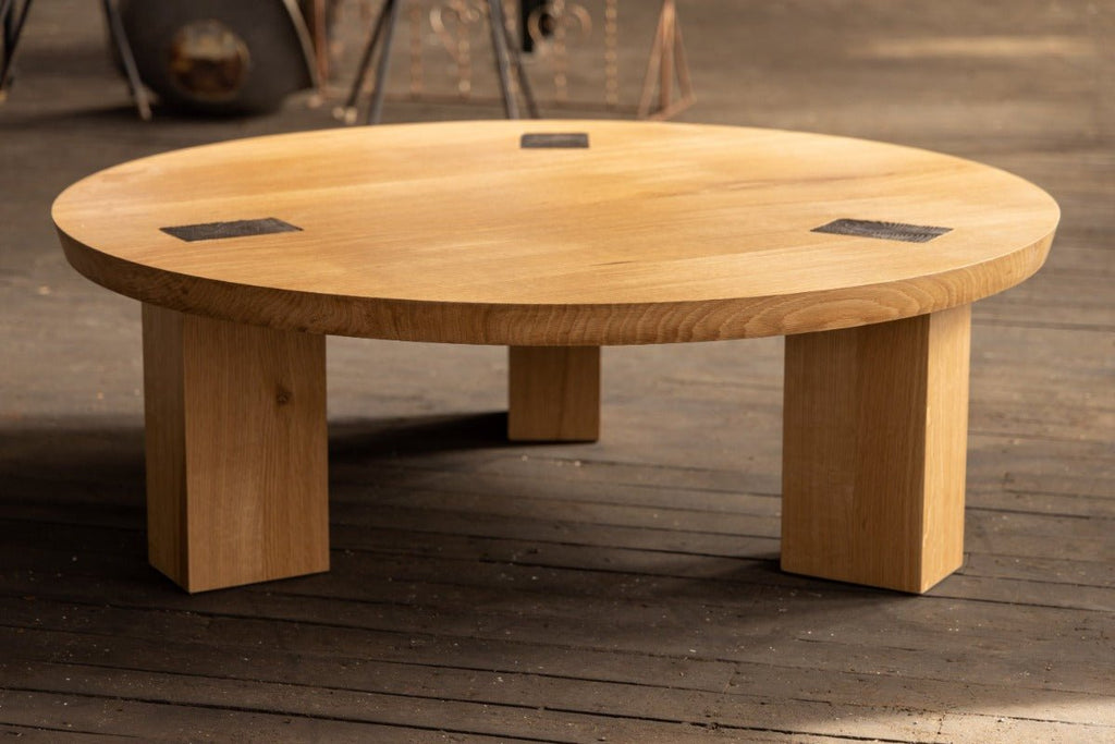 round bronze coffee table in white oak