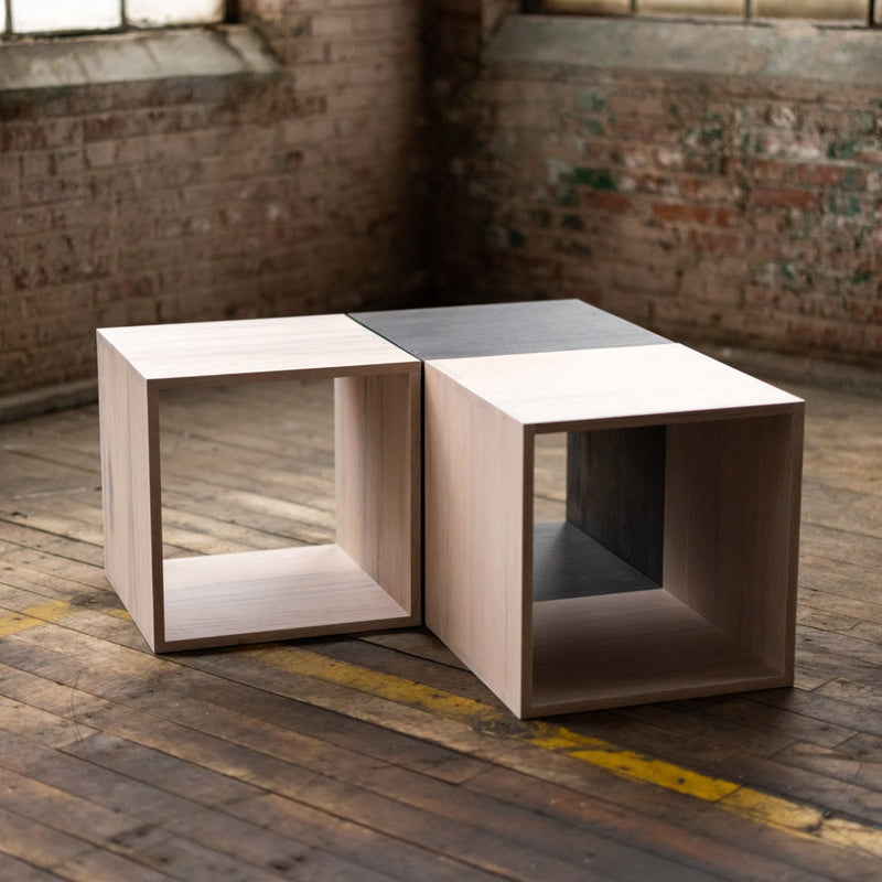 configuration of stackable wooden storage cubes black and white coffee table