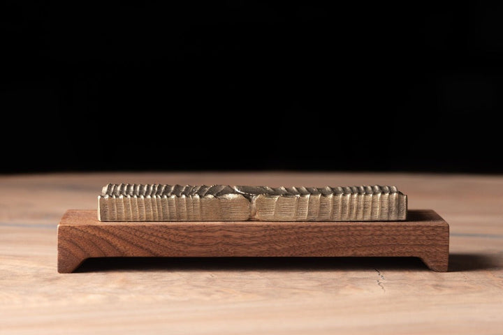 Incense Holder Modern Wood and Bronze Casting sitting on table