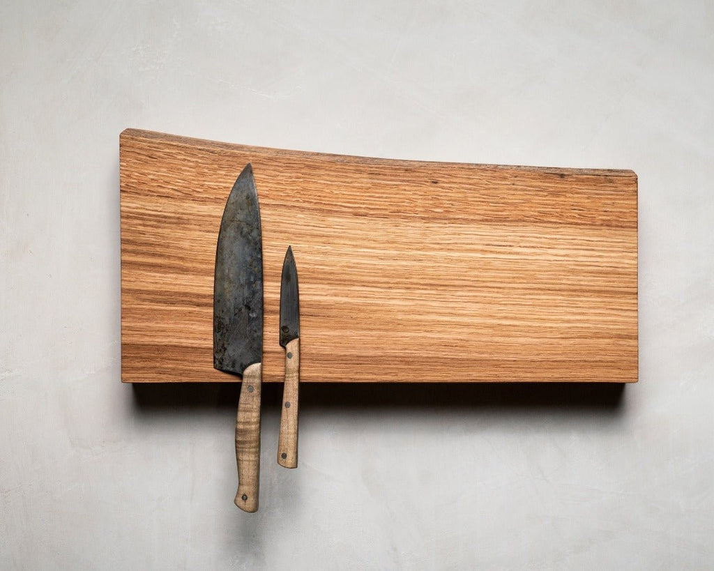 Magnetic Wooden Knife Holder holding kitchen knives