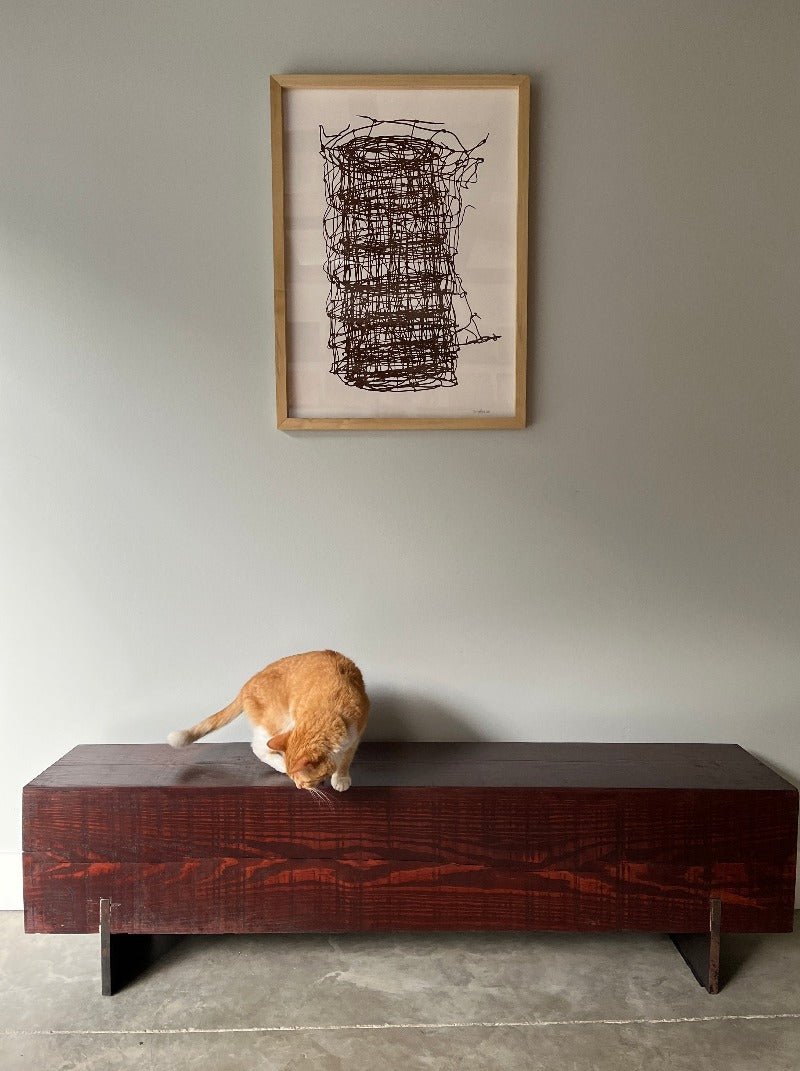 cat on mahogany bench